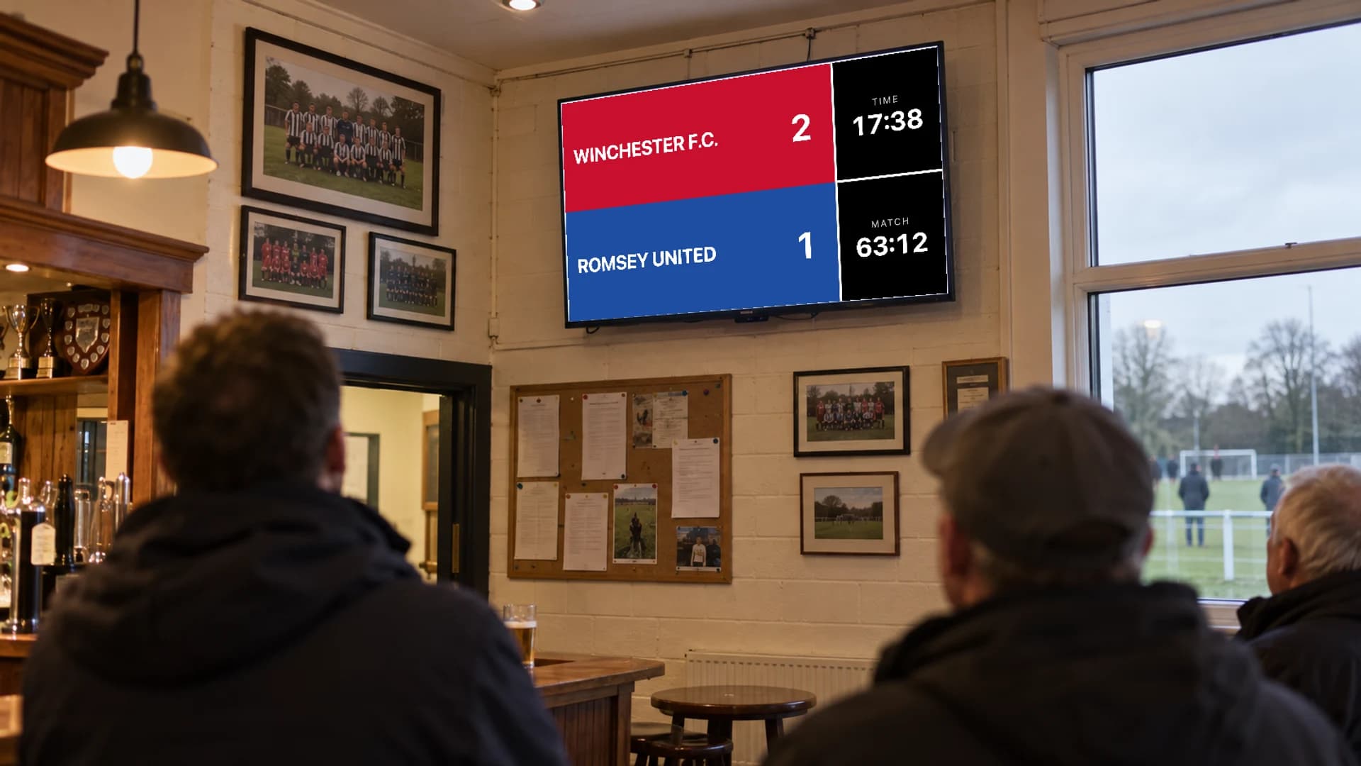 A TV in a clubhouse showing the PlayOverlay spectator scoreboard with both teams, the score and the time